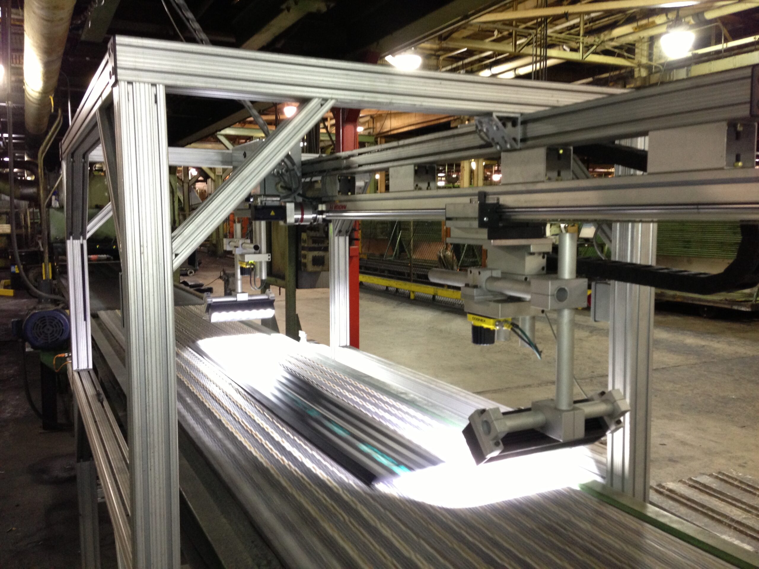 Tire treads being measured to an accuracy of 0.001 inches at a rate of 300 feet per minute.